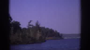 Sacramento California USA (1966): Trees And Grass On The Side Of A River With Blue