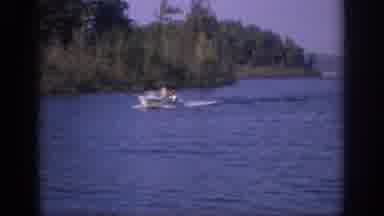 Sacramento California USA (1966): A Motorboat Moves Slowly Through A Body Of Water