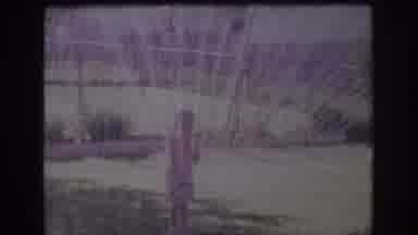 Sacramento California USA (1966): A Child Plays Next To And Under A Water