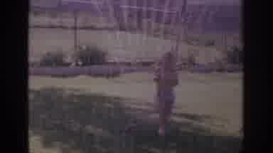 Sacramento California USA (1966): Child Running Through A Sprinkler In The