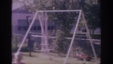 Sacramento California USA (1966): Vintage Video Of Child Playing With Sprinkler