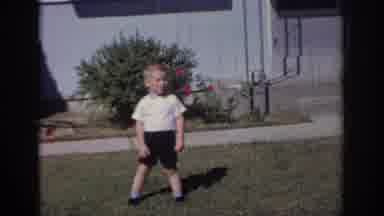 Sacramento California USA (1966): A Young Boy Notices A Man Carrying Bags Exiting