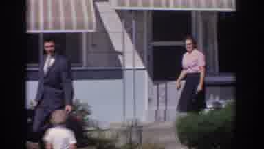 Sacramento California USA (1966): A Man And A Woman Walking Out Of The House,