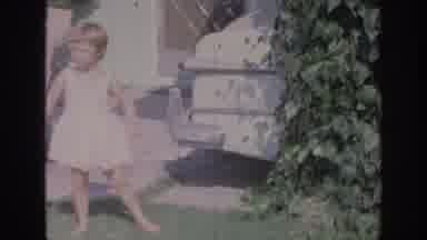 Oklahoma USA (1967): Girl Dancing While Mother Tends To Baby And Father Gets Ready
