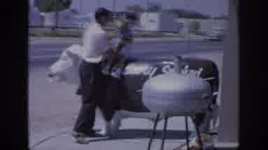 Oklahoma USA (1967): A Dad Placing His Infant Son On A Cow Statue At Some Tourist