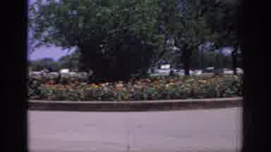 Oklahoma USA (1967): A Scene Of An Outdoor Flower Garden Followed By A Scene Of A