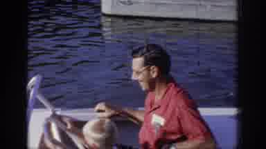 Oklahoma USA (1967): Man And Child Riding In A Small Boat With Child Driving