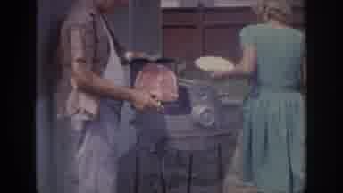 Oklahoma USA-1967: Family Grills Steak For A Neighborhood Backyard Party With