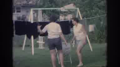 Oklahoma USA (1967): A Woman Hanging Laundry To Dry Outside In A Big Yard