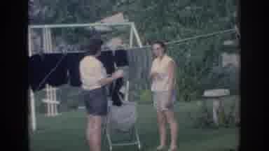 Oklahoma USA (1967): Video Two Women Outside Backyard Area, One Women Hanging