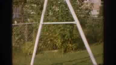 Oklahoma USA (1967): Scrolling Video Of A Backyard With Green Bushes And Grass
