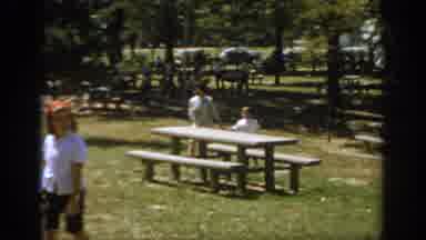 Oklahoma USA (1967): Girl And Boy Going Down A Slide At A Busy Park With More