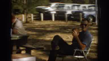 Oklahoma USA (1967): Man In Chair Holding Football At A Picnic With Family