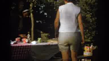 Oklahoma USA (1967): Woman Grabs Item From Picnic Table,Guests Arriving At Wedding