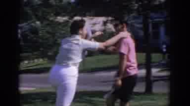 Oklahoma USA (1967): Woman Plays With Man In Home Garden Showing A Lot Of Joy