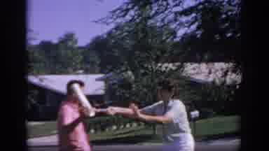 Oklahoma USA (1967): A Man And Woman Playing Tug-Of-War And The Woman Being Tapped