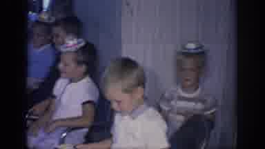 Oklahoma USA (1967): Boys And Girls Wearing Party Hats Sit In Chairs Lined Up