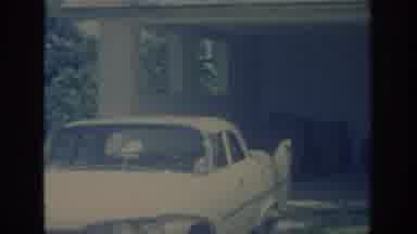 Oklahoma USA (1967): A Camera Panning From Right To Left Of A Parked Car Next To A