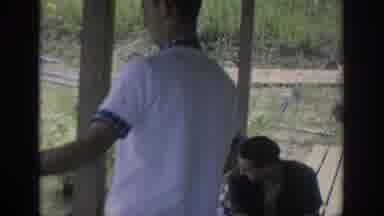 Oklahoma USA (1967): 3 Adults Looking At A Little Boy Go Towards The Water On A