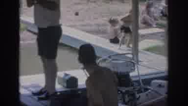 Oklahoma USA (1967): Father In Water With Son Near Boat Dock With Family