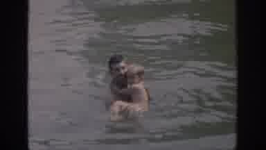Oklahoma USA (1967): Man Swimming In Lake With Son
