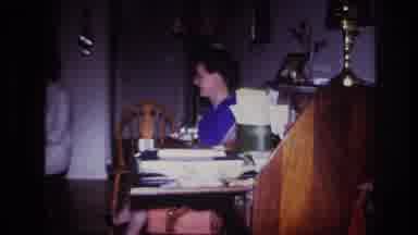 Rockaway Beach New York USA (1967): Woman In Blue Beside Cluttered Wooden Desk,