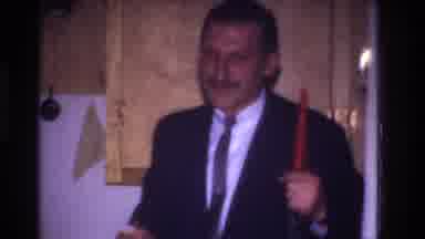 Rockaway Beach New York USA (1967): A Man Holds An Unlit Candle And Waves It