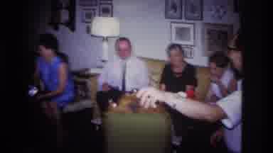 Rockaway Beach New York USA (1967): Several People Are Sitting On A Couch Around A