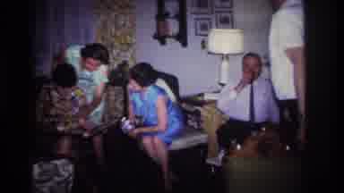Rockaway Beach New York USA (1967): Family Looking At Old Photos