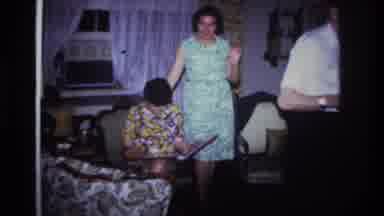 Rockaway Beach New York USA (1967): Two Women Looking At A Photo Album In The