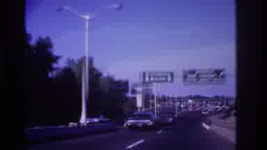 Rockaway Beach New York USA (1967): Driving On A Busy Road On A Sunny Day Very