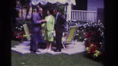 Rockaway Beach New York USA (1967): Group Of People Talking Animatedly In The