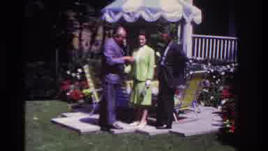 Rockaway Beach New York USA (1967): Grandparent Showing Off His Watch To Son And