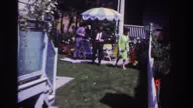 Rockaway Beach New York USA (1967): Party Backyard Couple Man Woman Umbrella Fence