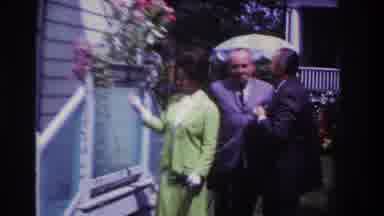 Rockaway Beach New York USA (1967): Woman And Two Man Admiring Flowers From