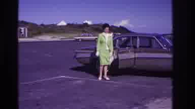 Rockaway Beach New York USA (1967): A Woman Opens And Shuts The Door To A Car In A