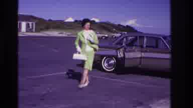 Rockaway Beach New York USA (1967): A Wealthy Woman Exits Her Car In A Parking Lot