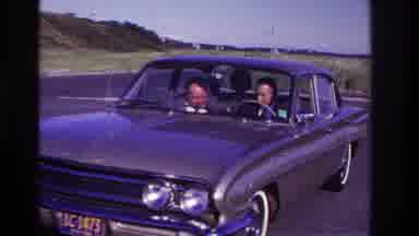 Rockaway Beach New York USA (1967): Two Men Talking And Looking At Something In A