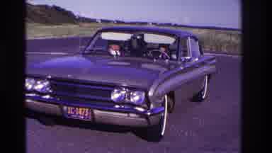 Rockaway Beach New York USA (1967): Man Driving A Car