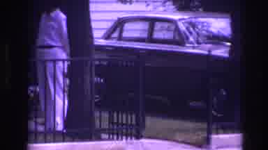 Rockaway Beach New York USA (1967): Man Standing In Front Of Vehicle In White Suit