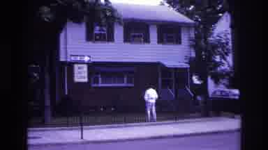 Rockaway Beach New York USA (1967): Individual Chatting With People Sitting In