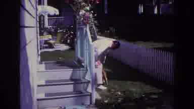 Rockaway Beach New York USA (1967): A Man And A Woman Play With A Cat In The