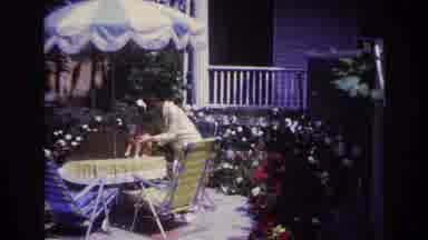 Rockaway Beach New York USA (1967): Video, Older Woman Outside Petting A Orange