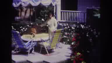 Rockaway Beach New York USA (1967): Woman Petting An Orange Tabby Cat That Is