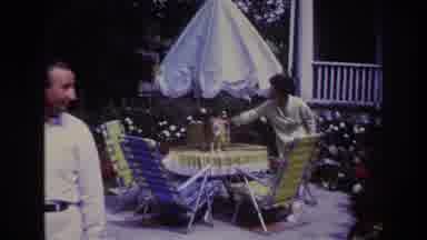 Rockaway Beach New York USA (1967): Couple Play With Their Cat Outside Their House