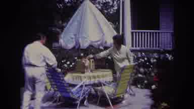 Rockaway Beach New York USA (1967): Man And Woman Playing With Cat On A Yellow