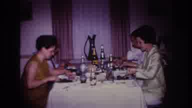 Rockaway Beach New York USA (1967): Four People Eating At A Table