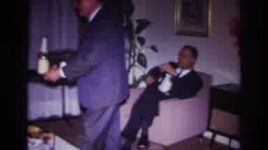 Rockaway Beach New York USA (1967): Man Offering Drinks To Guests At Evening