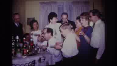 Rockaway Beach New York USA (1967): Extended Family Stands Around Dining Room