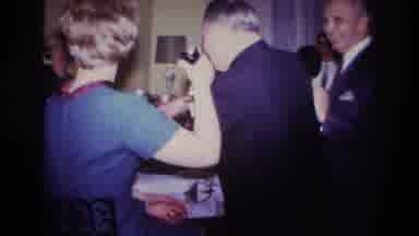 Rockaway Beach New York USA (1967): 1960s Well Dressed People Passing Drinks At A